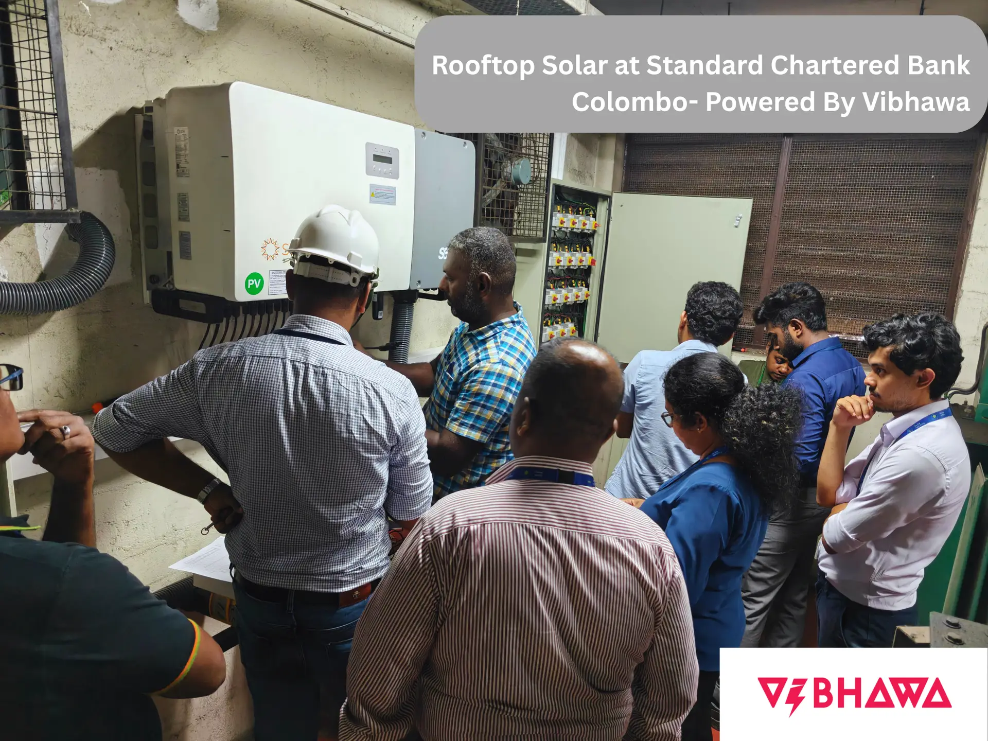 Vibhawa project team inspecting and testing the solar inverter setup