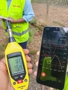 Energy Meter Calibration Services By Vibhawa Consultants 4 Vibhawa team measuring temperature and humidity during on-site energy meter calibration