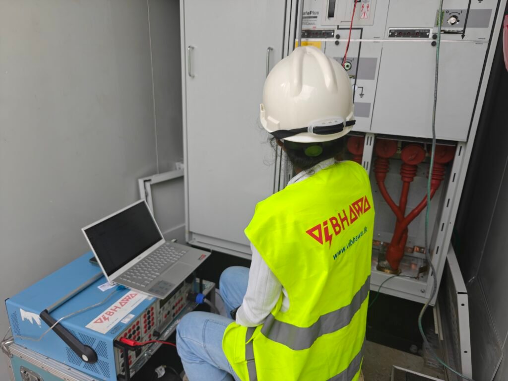 Vibhawa engineer testing protection on an ABB SafePlus medium-voltage ring main unit