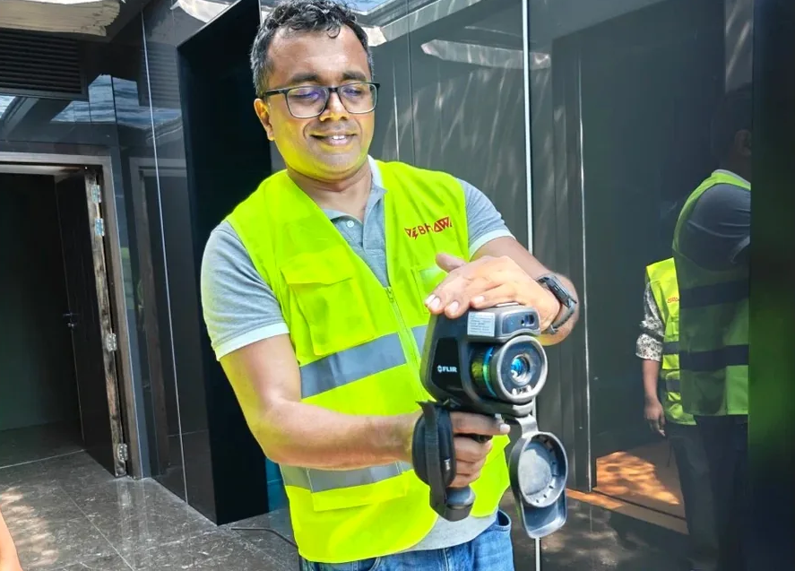 Vibhawa thermography specialist (Level 3 Certified) using a thermal imaging camera for electrical inspection