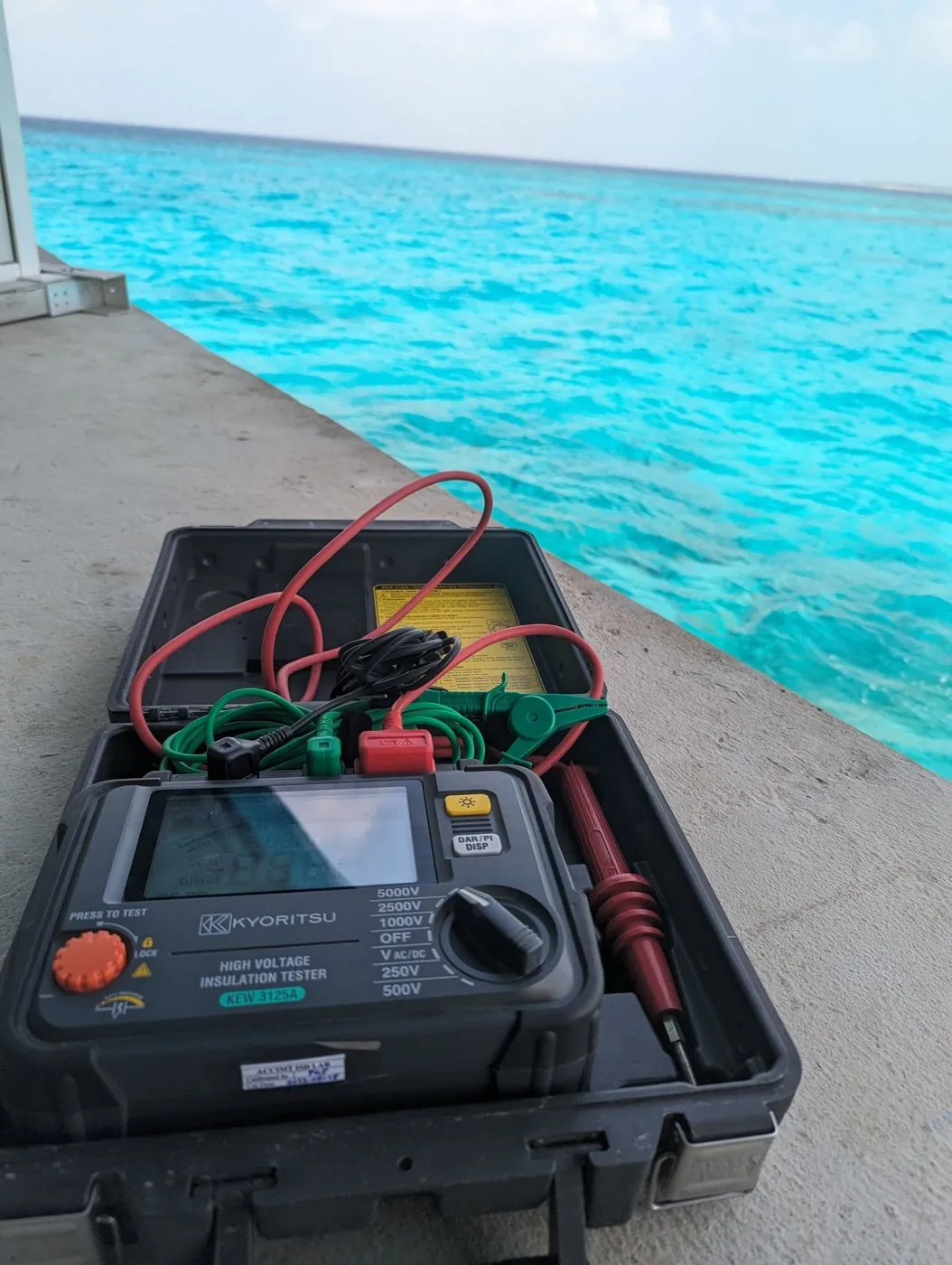 Calibrated insulation resistance tester on a jetty at a Maldives resort