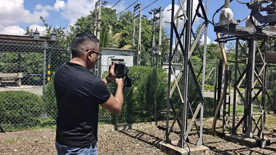Vibhawa engineer carrying out an infrared survey of an outdoor substation