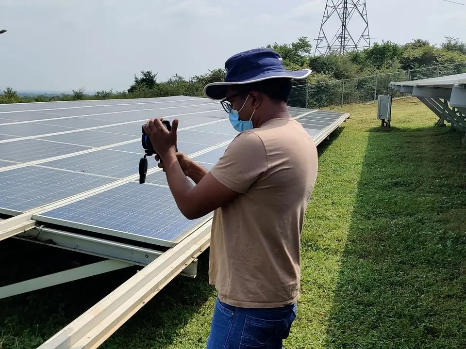 Solar Pv Consultancy 1 Vibhawa engineer carrying out an infrared inspection of a ground-mounted solar PV array for a solar PV consultancy project