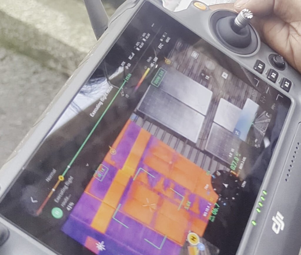 Radiometric thermal image of a rooftop solar PV array on the drone controller during a Vibhawa aerial thermography survey in Sri Lanka